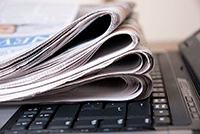 Photo of a newspaper on a laptop keyboard
