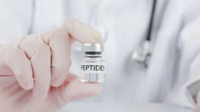 health practitioner holding peptides